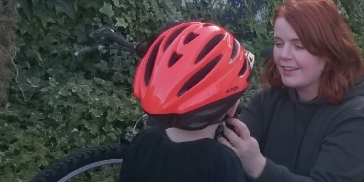 Neasa with child on bike